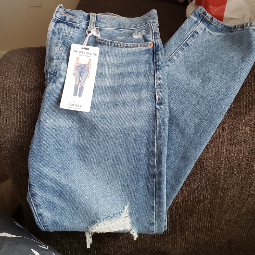 Distressed denim jeans.